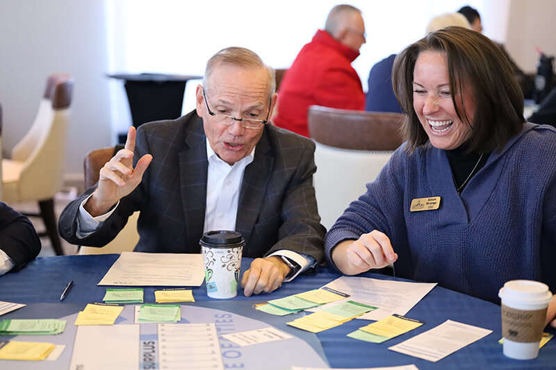Two Elected Officials at a Table