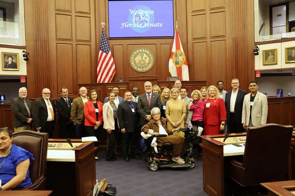 Group of people on the floor of the Florida Senate